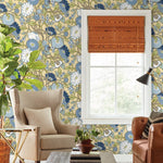 yellow blue floral wallpaper on the wall, beautiful beige chair and brown leather sofa