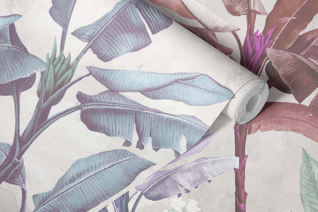 Roll of wallpaper with tropical leaf design on a neutral background