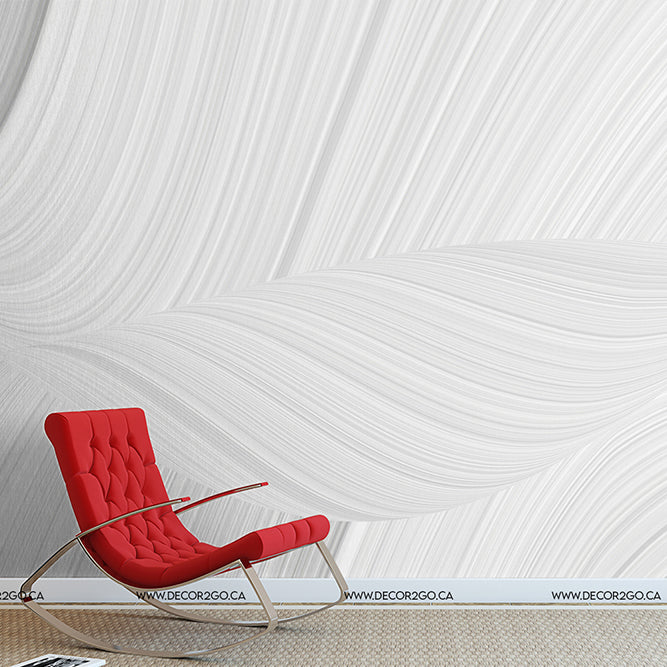 A modern red lounge chair sits against a textured white wall with swirling patterns, in a minimalist room featuring Decor2Go Wallpaper Mural.