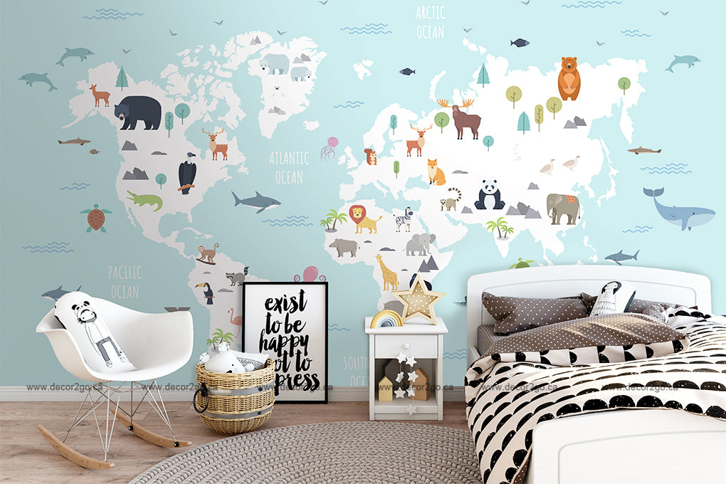 A children's bedroom features a Decor2Go Wallpaper Mural World Map with Wild Animals Blue Wallpaper Mural with animals representing different regions. The space includes a bed with polka-dot bedding, a white nightstand, a modern white chair, and framed quotes. Toy decor and a cozy ambiance complete the playful look.