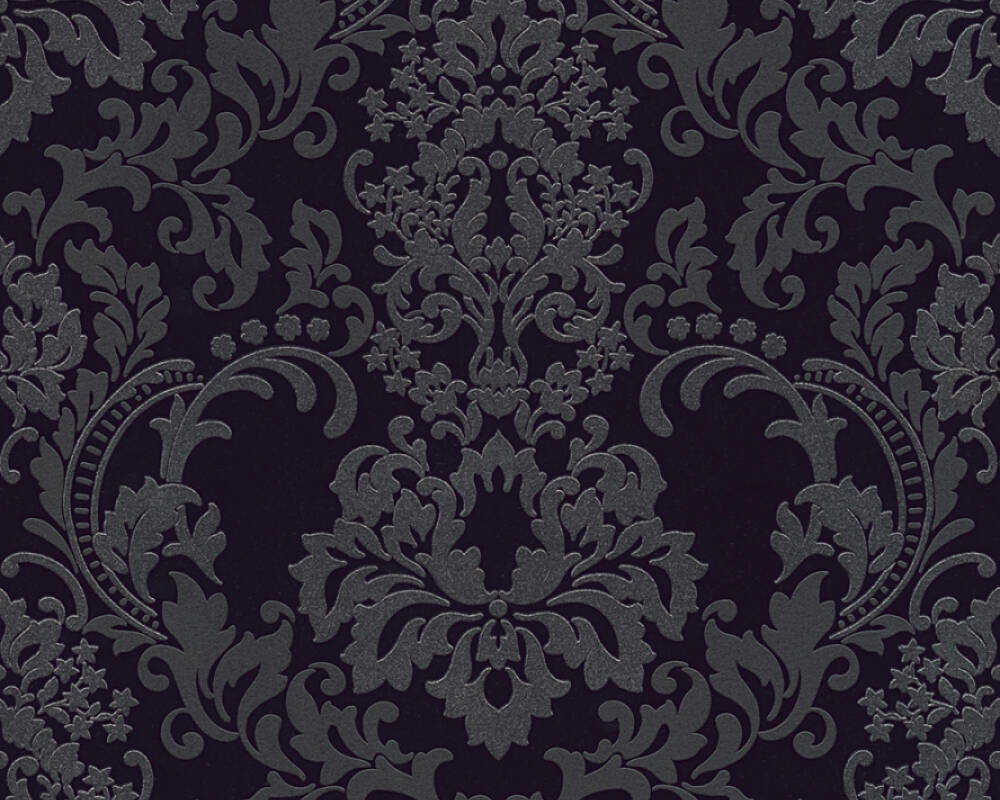 An intricate, dark grey damask ornament with floral and ornamental motifs on a black background. The design features detailed, symmetrical foliage and curling vines, creating a sophisticated and classic Baroque design. This Ontario Baroque Black Wallpaper exudes timeless elegance.