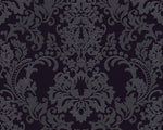 The Black Baroque Black Wallpaper by Ontario showcases a classic Baroque design with a dark, ornate damask pattern adorned with intricate floral and leaf motifs. Its symmetrical layout highlights elegant curves and flourishes on a deep black background, enhancing the sophisticated contrast of this textured wallpaper.