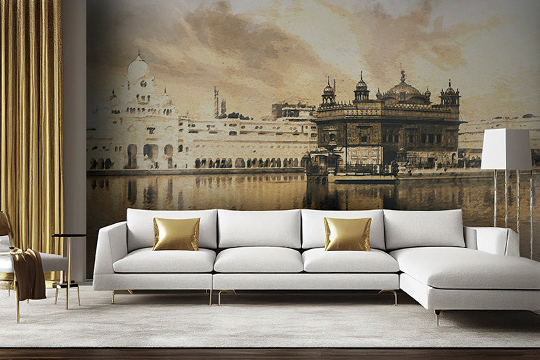 Modern living room with a large sofa and golden cushions, featuring a wall-sized sepia-toned Decor2Go Wallpaper Mural of the Golden Temple reflected in water.