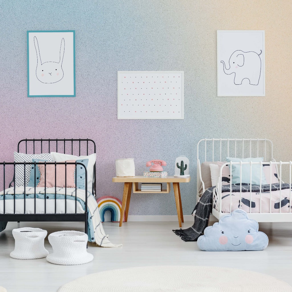 A colorful children's room with two metal-frame beds, animal-themed wall art, a small desk with books, decorative plants, and a cloud-shaped pillow on the floor featuring Decor2Go Wallpaper Mural.