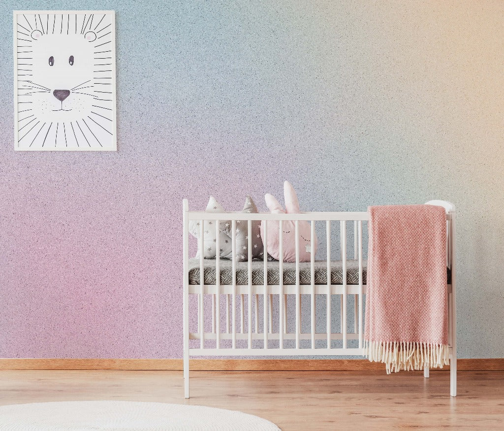 A cozy nursery room featuring a white crib with plush toys inside, a pink throw blanket on the side, and a Decor2Go Wallpaper Mural with a cartoon tiger poster.