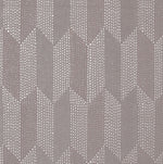 The Cosmopolitan Wallpaper by York Wallcoverings showcases an intricate geometric pattern with rows of metallic dots forming arrow shapes that point upwards. This design, in the Dark Oyster colorway, incorporates shades of beige and light brown to create a textured, raised effect across 60 square feet.