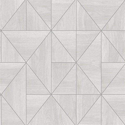A floor or wall pattern featuring light grey wooden tiles arranged in a geometric print. The design consists of squares and triangles forming a grid with alternating orientations, creating a dynamic and visually engaging layout reminiscent of the Cheverny Geometric Wood and Gold Wallpaper (56 SqFt) from York Wallcoverings.
