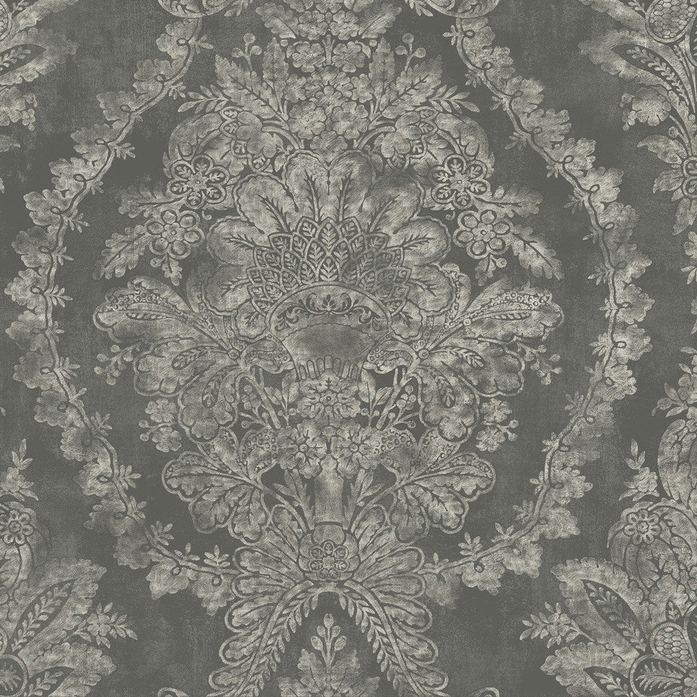 An ornate, dark gray Classic Charleston Damask Wallpaper in Blue (60 SqFt) by York Wallcoverings design featuring intricate floral and botanical patterns with symmetrical detailing. The elaborate artwork includes large, blooming flowers, leaves, and ornamental shapes, creating a vintage, textured appearance accentuated by pearlescent floral motifs.