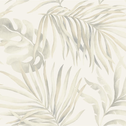 A soothing Paradise Palm Leaves (60 SqFt) wallpaper by York Wallcoverings featuring a pattern of light grey and beige tropical palm and monstera leaves on a soft off-white background. The life-size leaves overlap, creating a serene, botanical design that is calm and inviting.