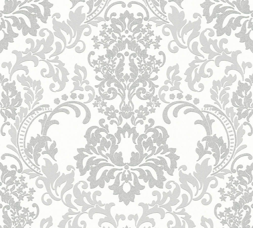 A detailed, elegant damask pattern wallpaper in white and light grey. The intricate design features symmetrical floral and leafy motifs, creating a classic, ornate look. This Baroque White and Light Grey Wallpaper by Ontario with its repeating pattern exudes a sense of luxury and sophistication on a textured surface.