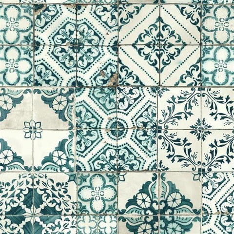 A square pattern of ornate, vintage-style tiles with intricate designs in shades of turquoise, white, and gray. Each tile features unique floral and geometric motifs, adding a classic and artistic touch to the overall mosaic. This **Mediterranean Tile Wallpaper by York Wallcoverings** is vinyl-coated for durability and prepasted for easy application.